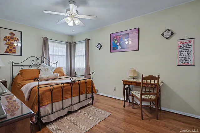 a bedroom with a bed and a desk