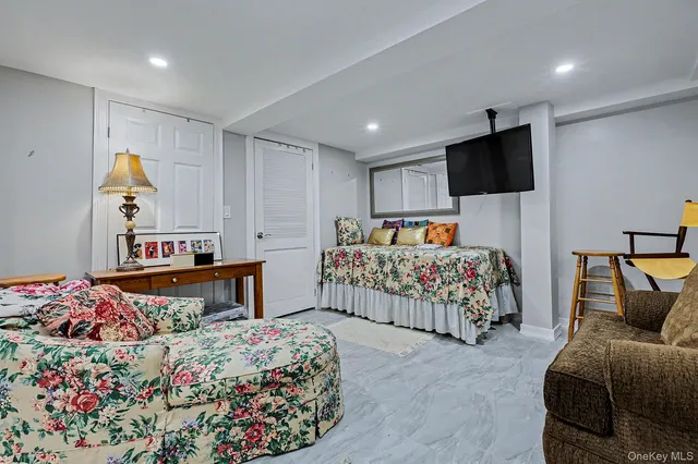 a bedroom with furniture and a bed