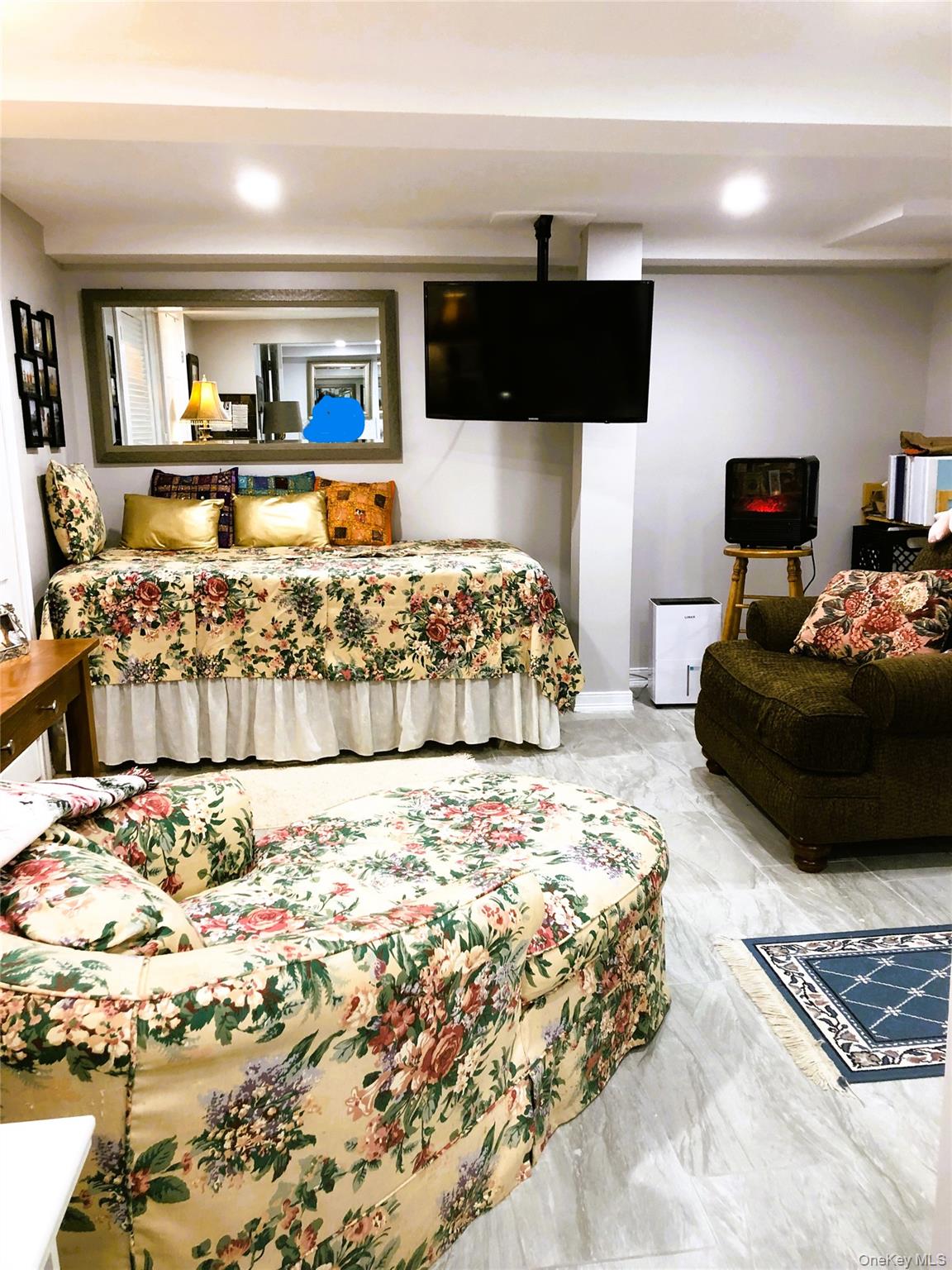 24 Cedar Road Westbury, NY 11590 - Photo 19 of 21 Bedroom with light marble finish floors and recessed lighting