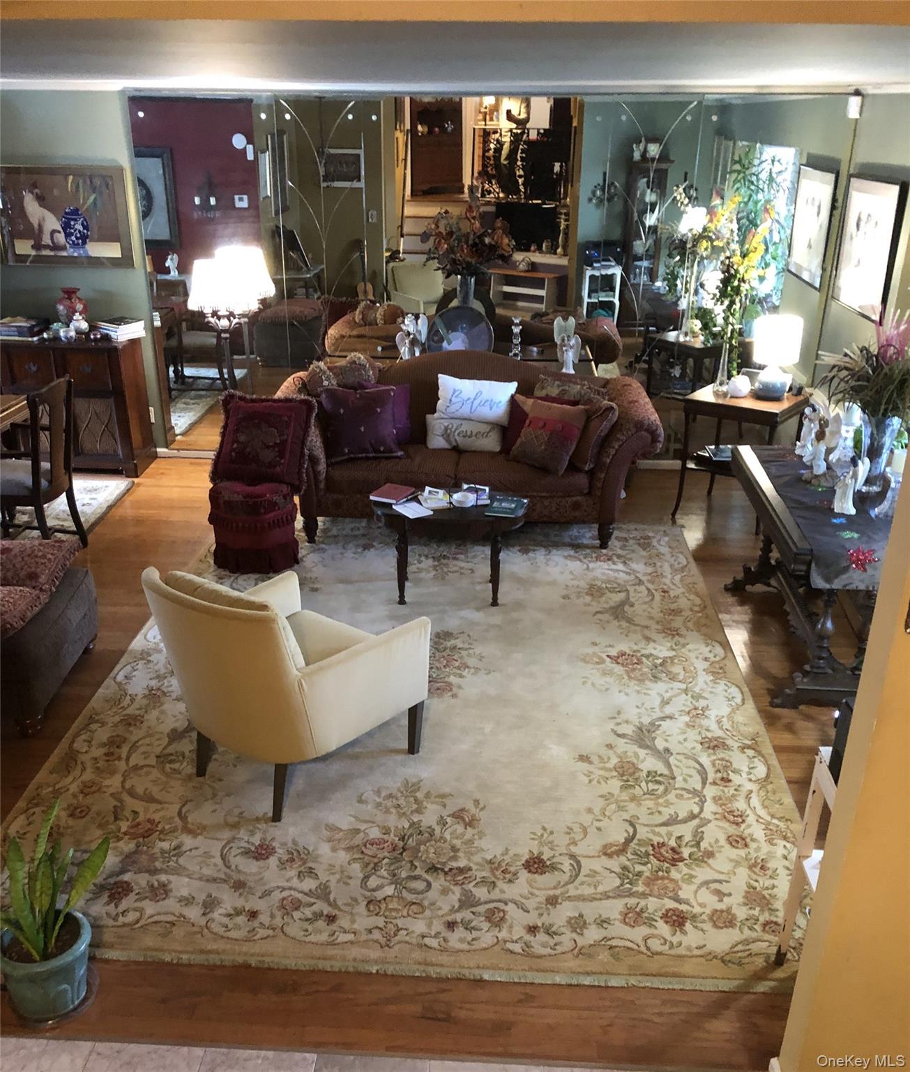 24 Cedar Road Westbury, NY 11590 - Photo 3 of 21 Living area with wood finished floors