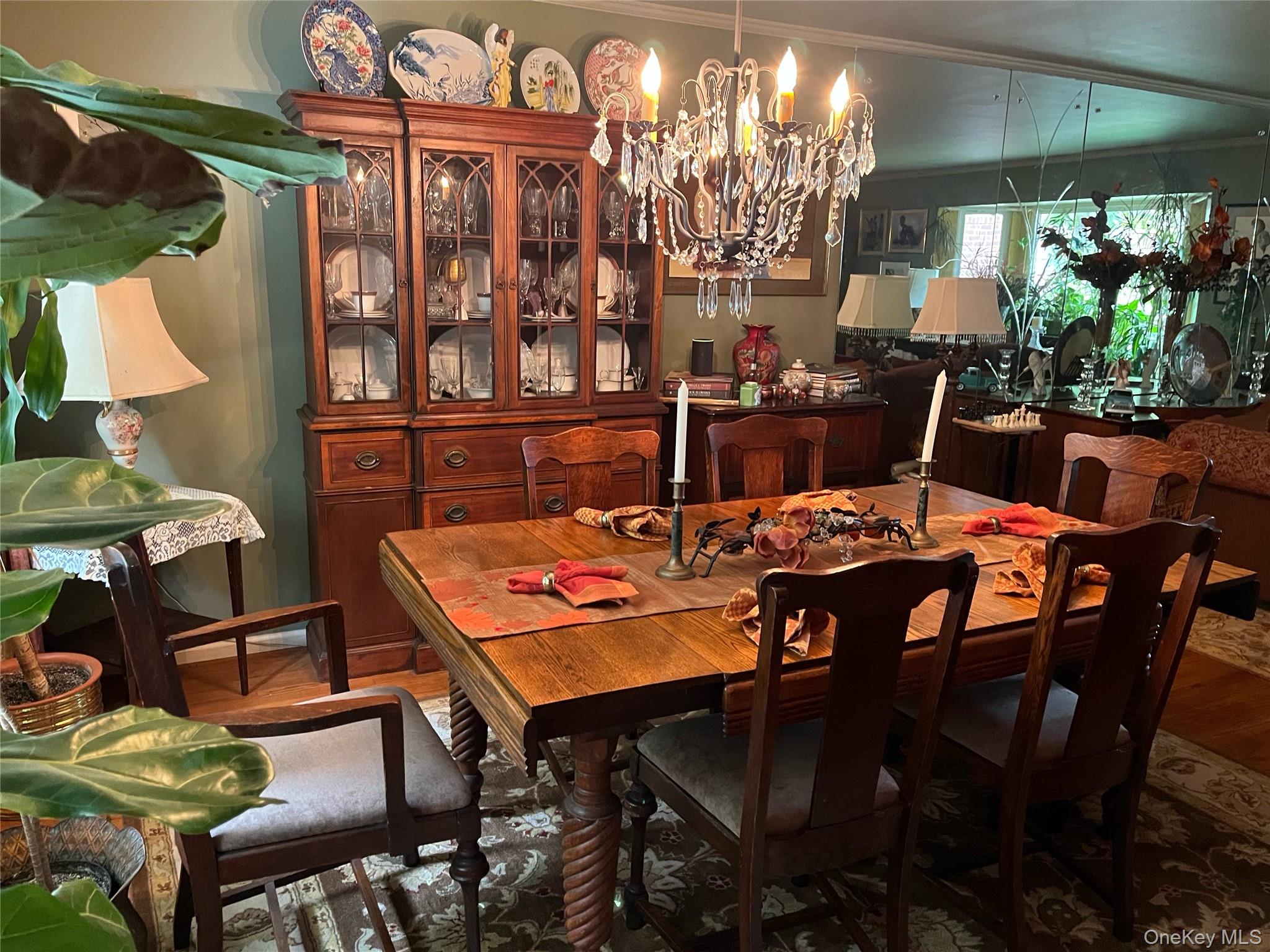 24 Cedar Road Westbury, NY 11590 - Photo 7 of 21 Dining area featuring a chandelier and crown molding