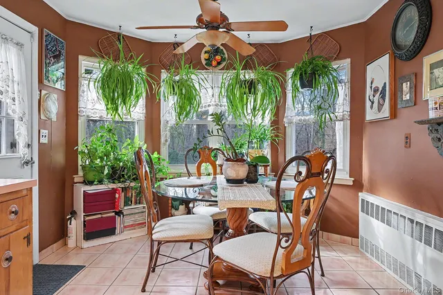 a view of a patio with a table and chairs under an umbrella