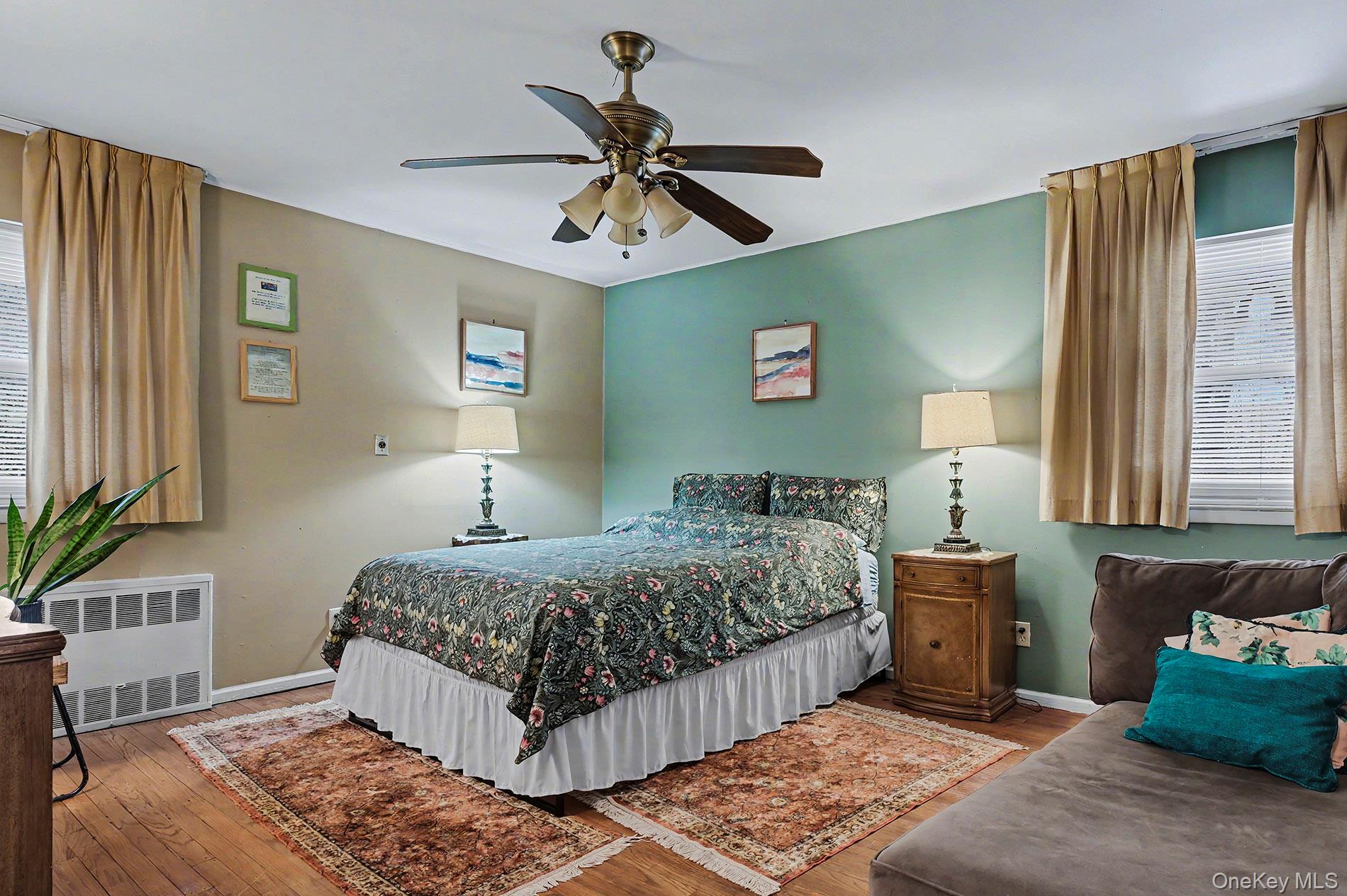 24 Cedar Road Westbury, NY 11590 - Photo 9 of 22 a bedroom with a bed and window