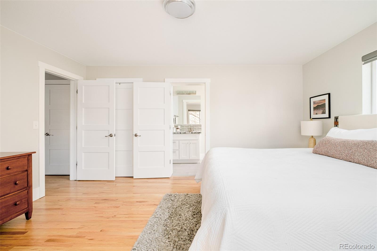 2048 Meade Street Denver, CO 80211 - Photo 14 of 50 a bedroom with a bed and cabinets