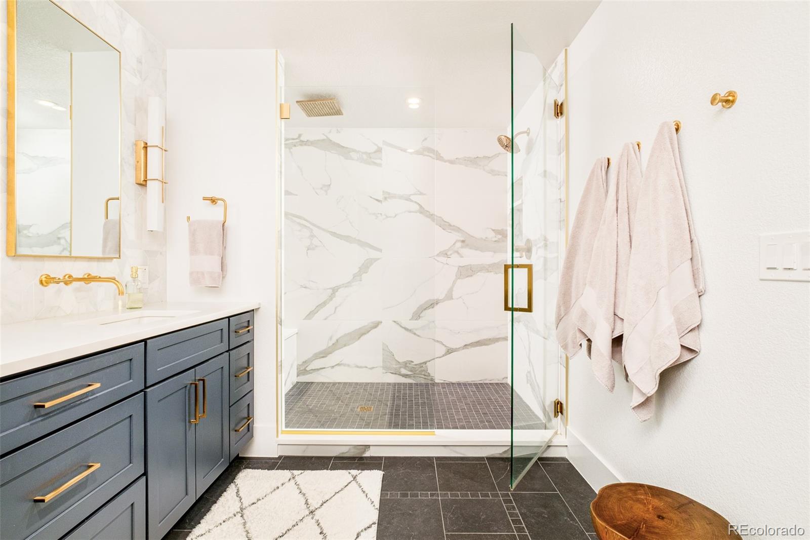 2048 Meade Street Denver, CO 80211 - Photo 24 of 50 a bathroom with a granite countertop sink toilet and shower