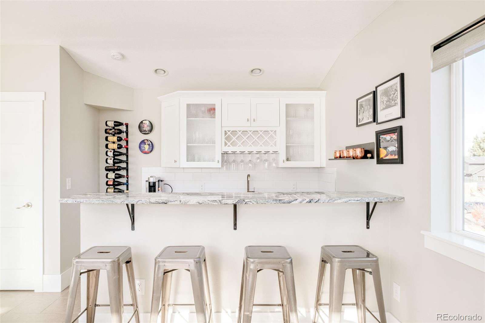2048 Meade Street Denver, CO 80211 - Photo 28 of 50 a kitchen with stainless steel appliances a sink and a cabinets