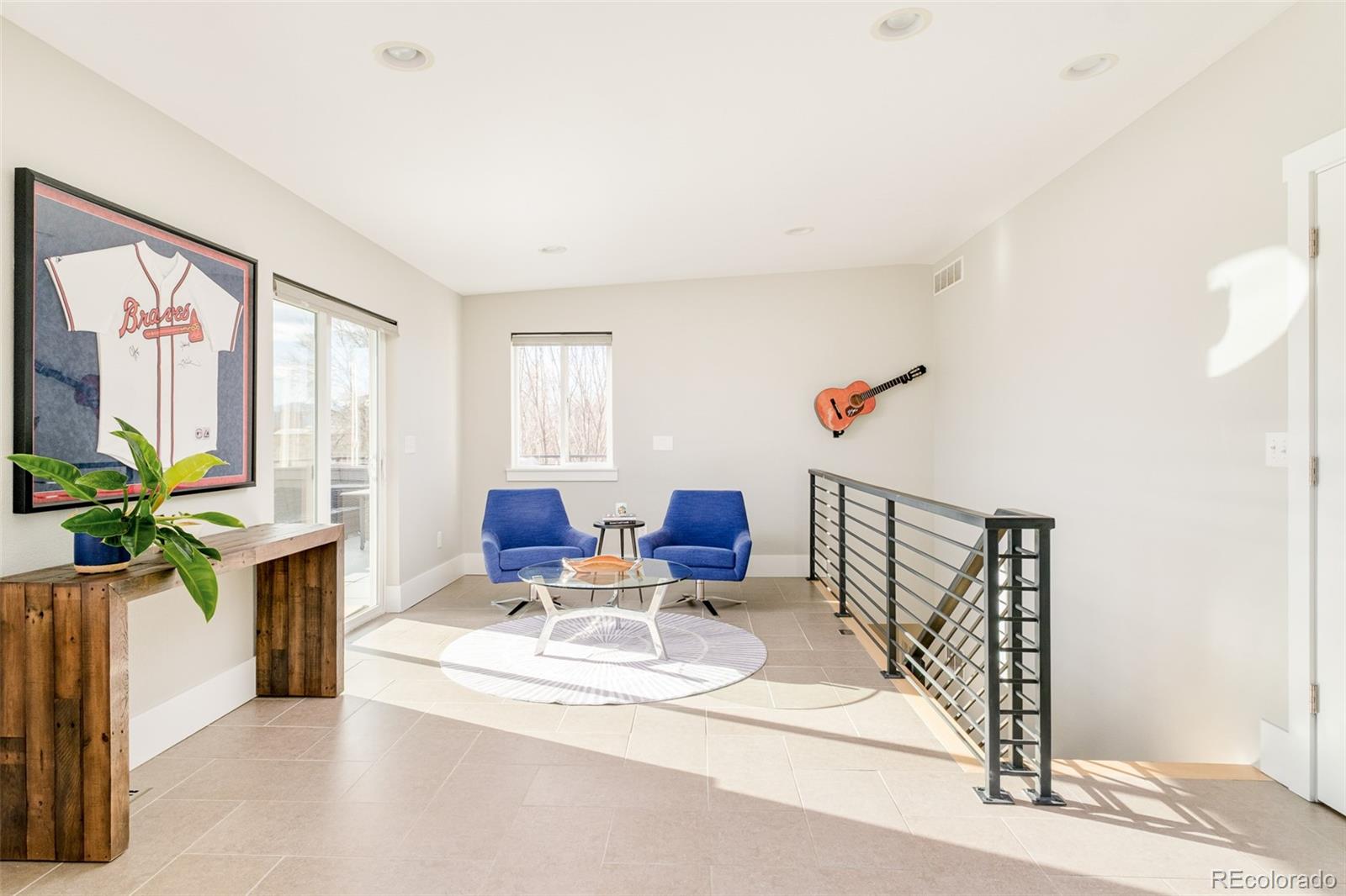 2048 Meade Street Denver, CO 80211 - Photo 29 of 50 a living room with furniture and a potted plant