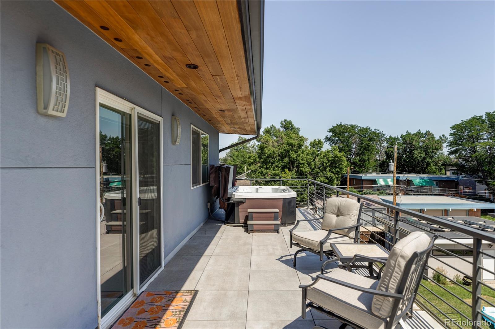 2048 Meade Street Denver, CO 80211 - Photo 30 of 50 a roof deck with couches and wooden floor