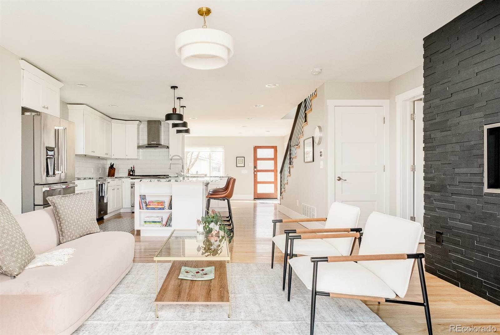 2048 Meade Street Denver, CO 80211 - Photo 10 of 50 a living room with furniture and kitchen view