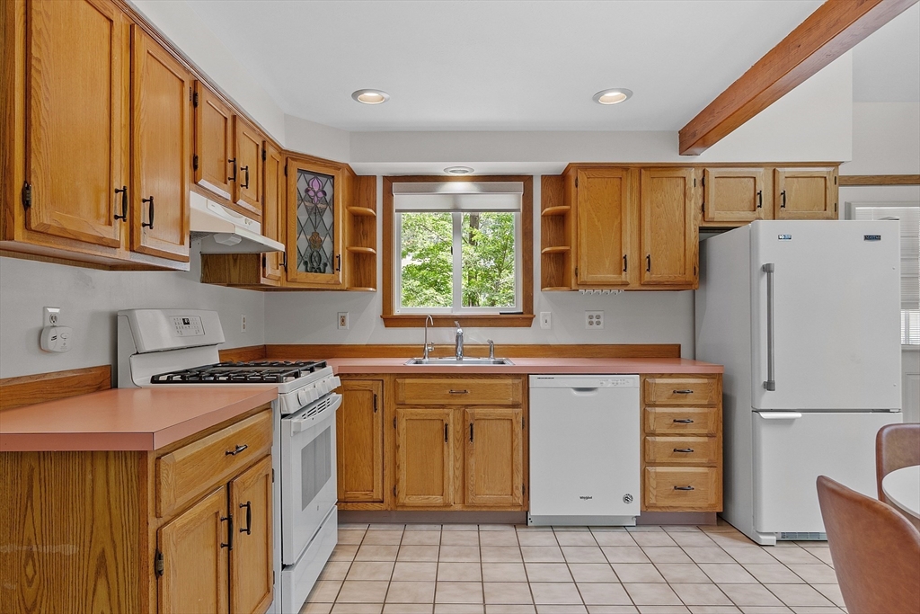 14 Boat House Road Groton, MA 01450 - Photo 12 of 41 a kitchen with a stove a sink and a refrigerator