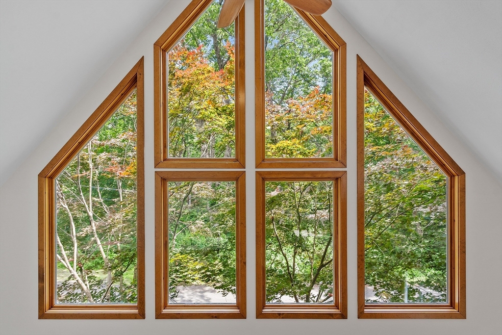 14 Boat House Road Groton, MA 01450 - Photo 19 of 41 a view of room with green trees and stairs