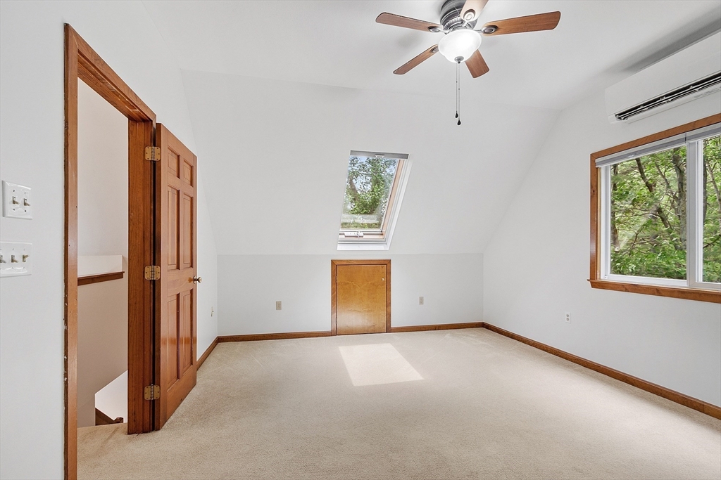 14 Boat House Road Groton, MA 01450 - Photo 22 of 41 an empty room with windows and fan
