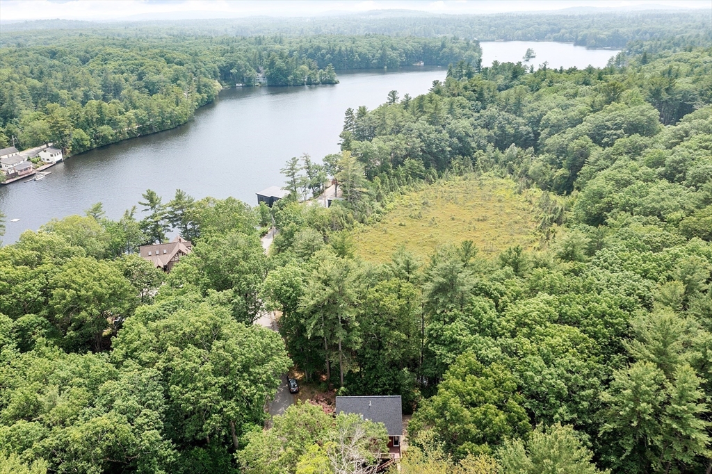 14 Boat House Road Groton, MA 01450 - Photo 35 of 41 an aerial view of green landscape with trees houses and lake view
