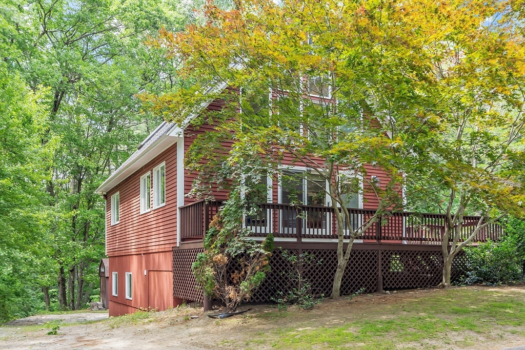 14 Boat House Road Groton, MA 01450 - Photo 4 of 41 a view of a house with backyard and sitting area