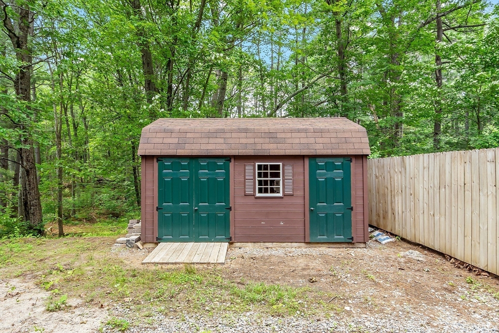 14 Boat House Road Groton, MA 01450 - Photo 41 of 41 a view of a house with a yard plants and large tree