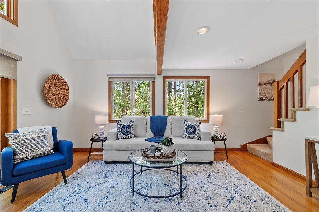 14 Boat House Road Groton, MA 01450 - Photo 7 of 41 a living room with furniture a rug and a large window