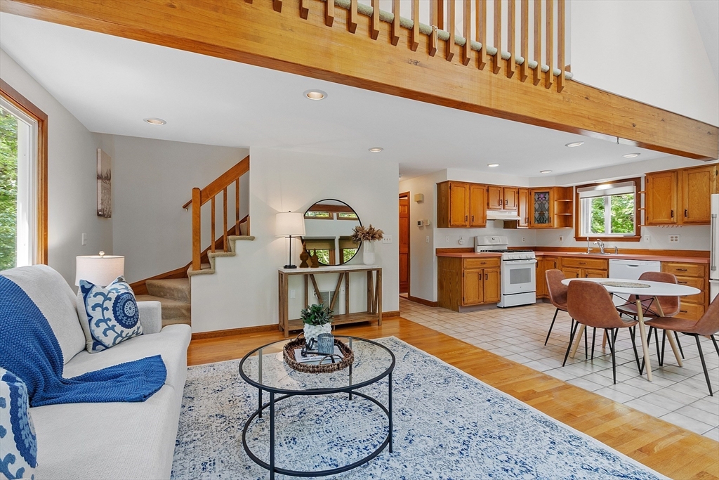 14 Boat House Road Groton, MA 01450 - Photo 9 of 41 a living room with furniture kitchen view and a table