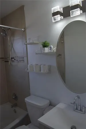 a bathroom with a sink and toilet