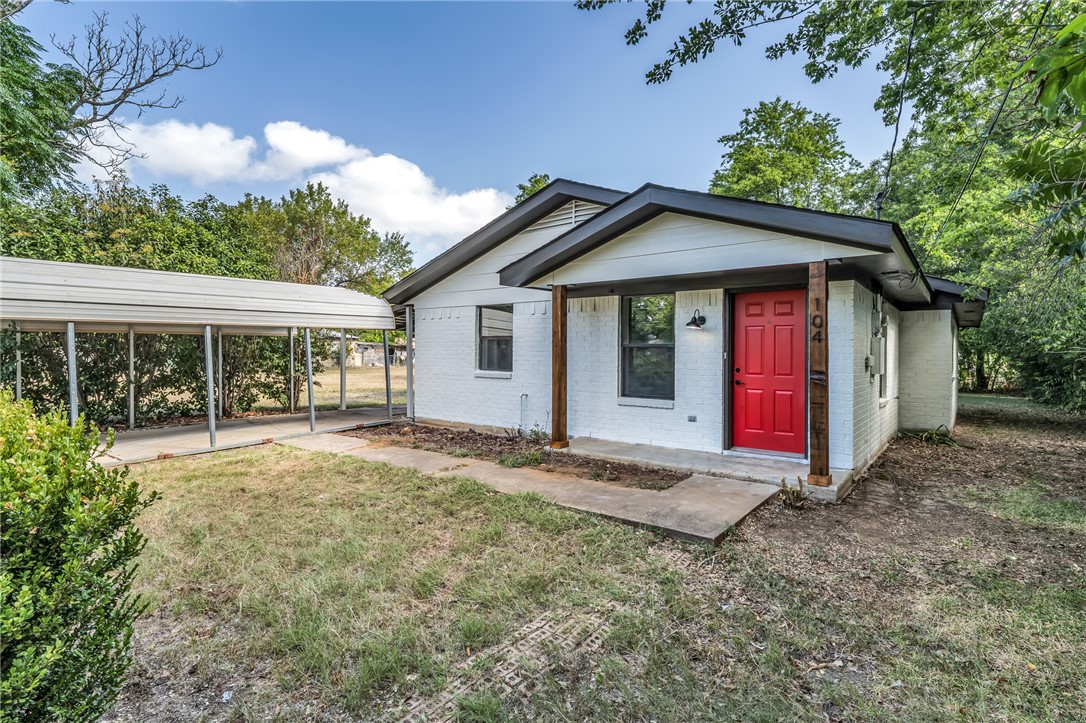 104 North Oneal Street Caldwell, TX 77836 - Photo 1 of 22 a view of a house with a yard and large tree