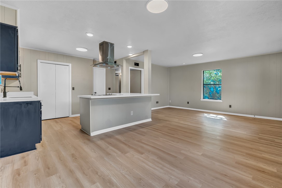 104 North Oneal Street Caldwell, TX 77836 - Photo 22 of 22 a view of a kitchen with kitchen island wooden floor and window