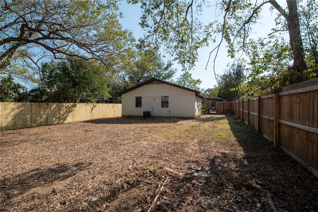 104 North Oneal Street Caldwell, TX 77836 - Photo 20 of 22 a house with trees in the background