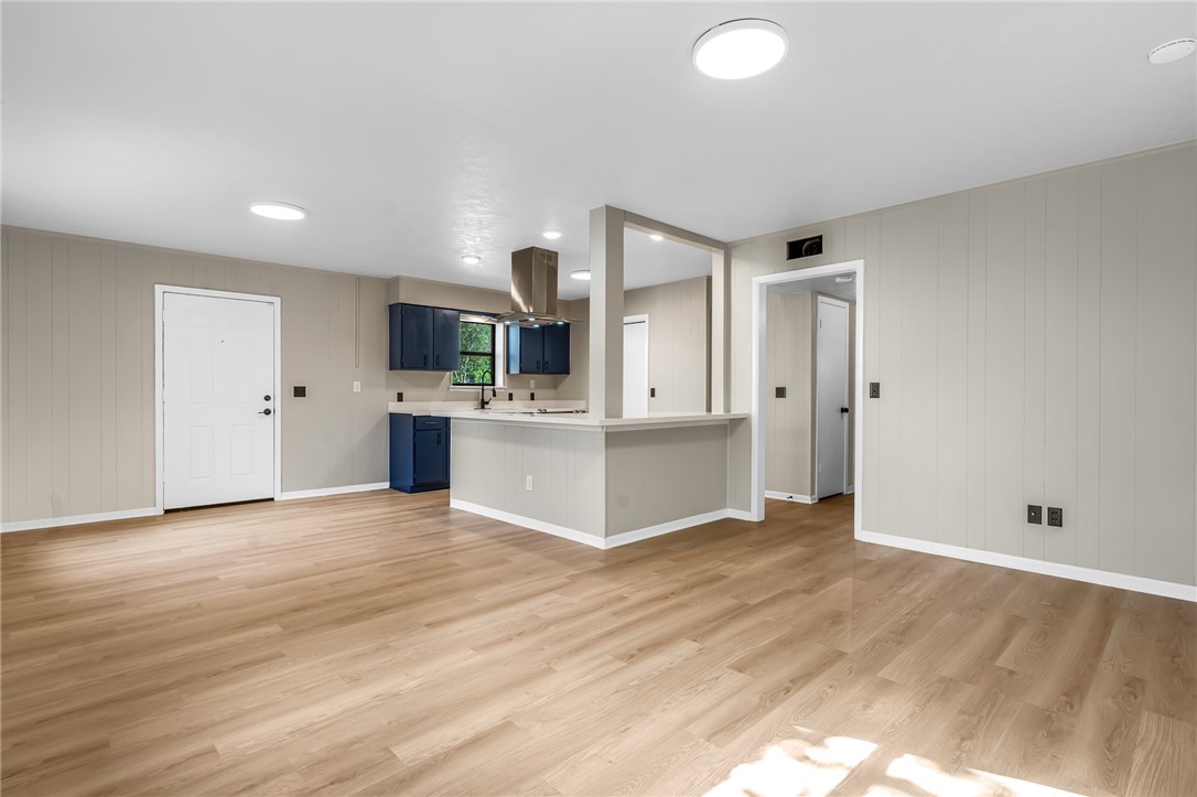 104 North Oneal Street Caldwell, TX 77836 - Photo 5 of 22 a view of a kitchen with wooden floor and white walls