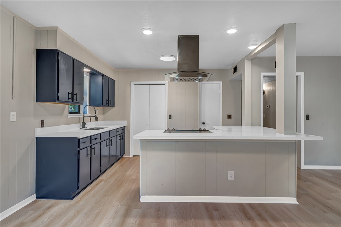104 North Oneal Street Caldwell, TX 77836 - Photo 9 of 22 a large kitchen with kitchen island a sink a center island stainless steel appliances and a cabinets