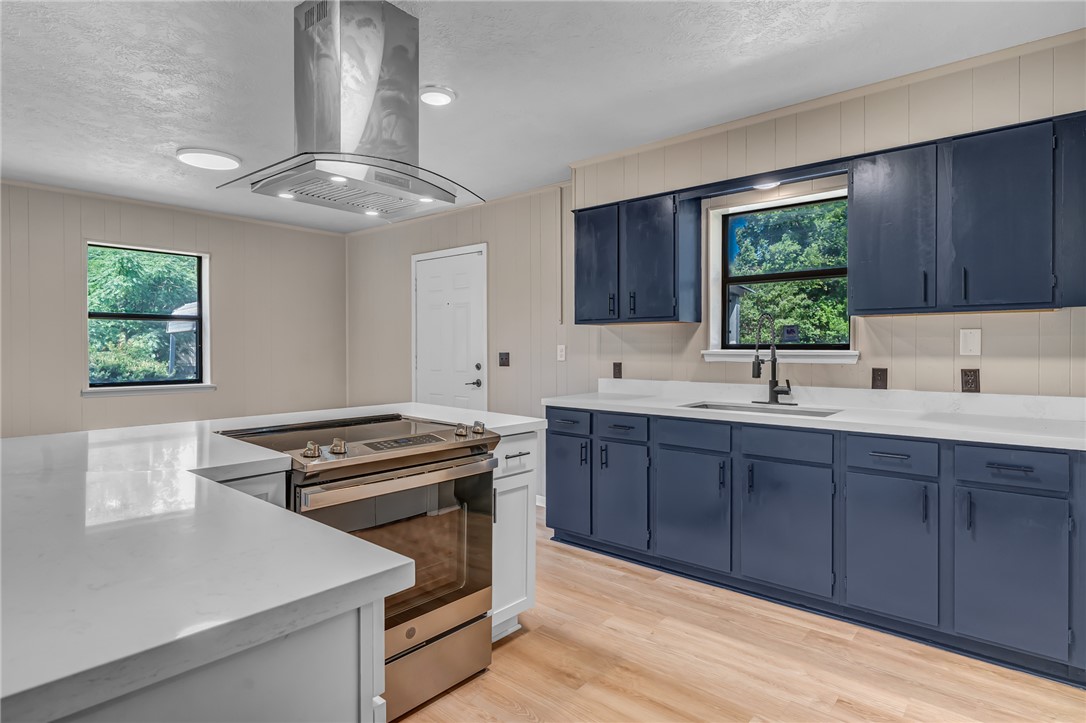104 North Oneal Street Caldwell, TX 77836 - Photo 10 of 22 a kitchen with a stove a sink and a window