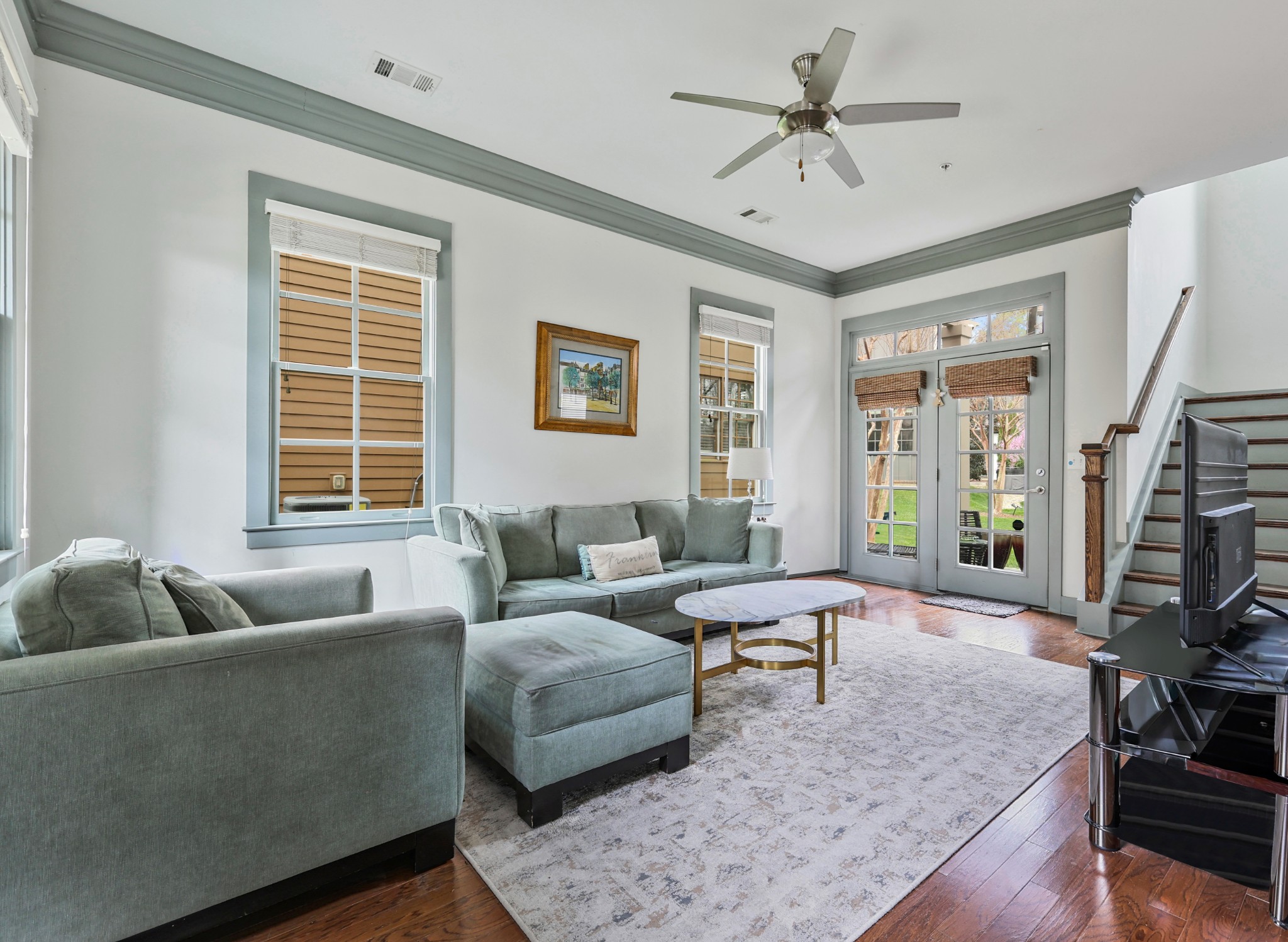 101 Cottage Lane Franklin, TN 37064 - Photo 1 of 20 a living room with furniture floor to ceiling window and a flat screen tv