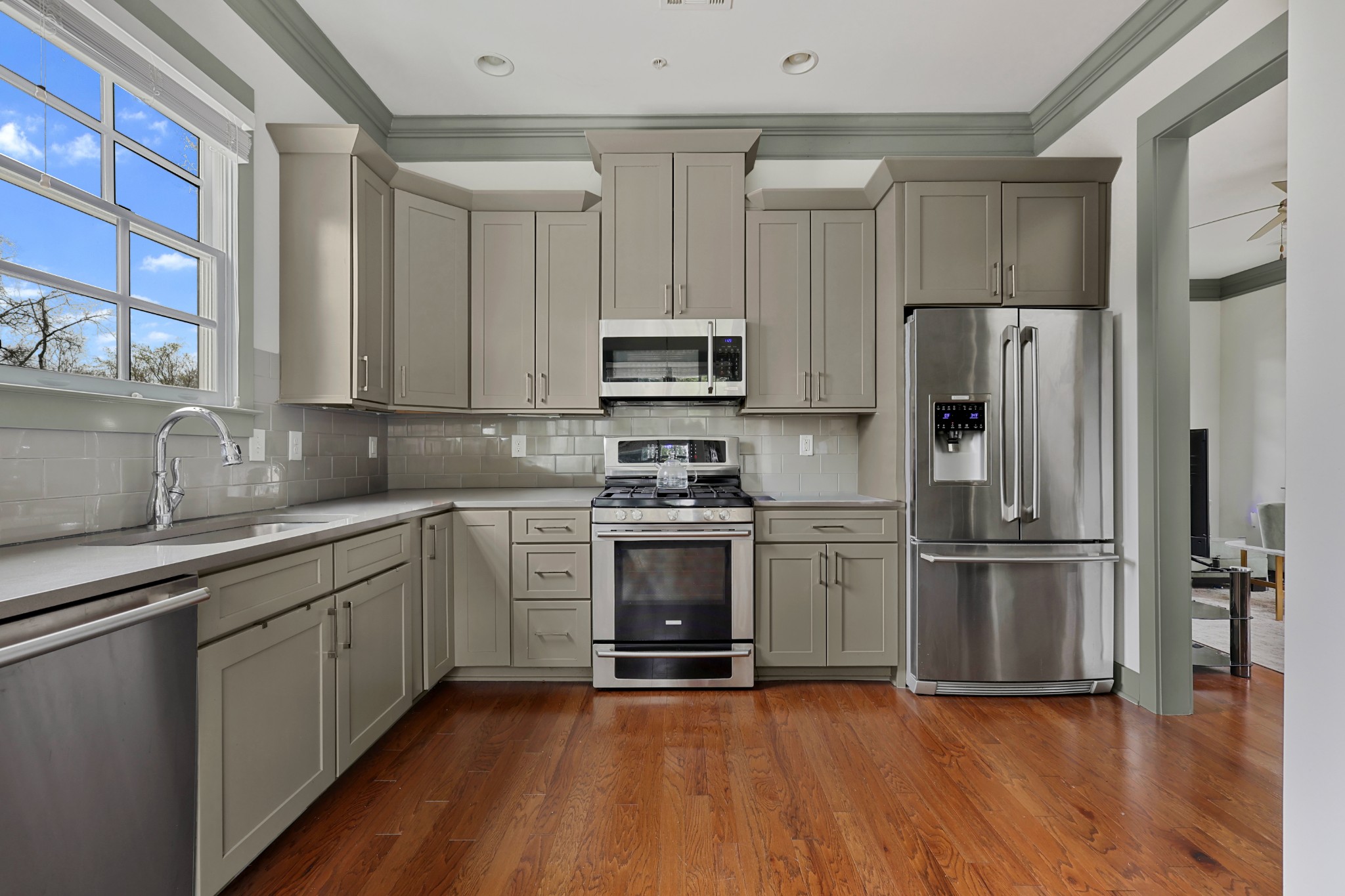 101 Cottage Lane Franklin, TN 37064 - Photo 11 of 20 a kitchen with granite countertop a refrigerator and a sink
