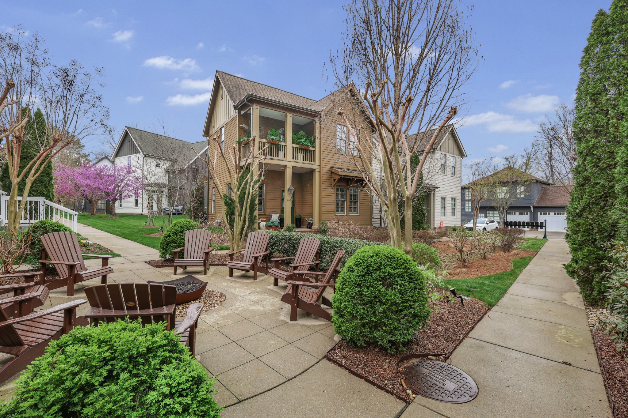 101 Cottage Lane Franklin, TN 37064 - Photo 20 of 20 a view of a patio with couches table and chairs with potted plants and a large tree