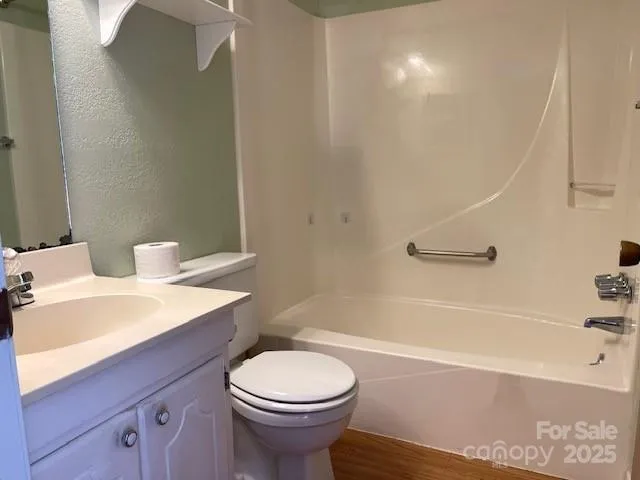 a bathroom with a sink a toilet and bathtub