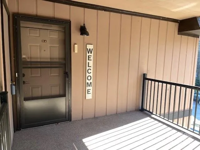 a view of a wooden door with a wooden door