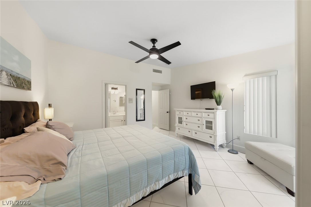 10 Rising Sun Court Henderson, NV 89074 - Photo 18 of 38 Spacious primary bedroom with ceiling fan/light, windows providing natural light