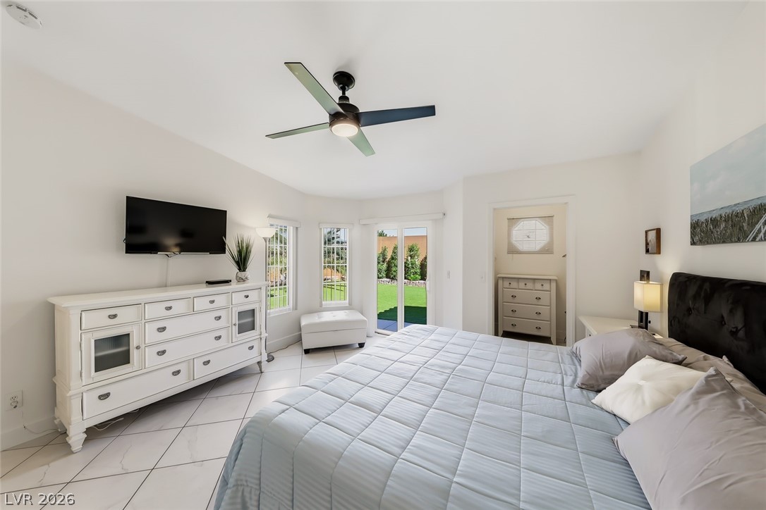 10 Rising Sun Court Henderson, NV 89074 - Photo 19 of 38 Primary bedroom with access to the backyard