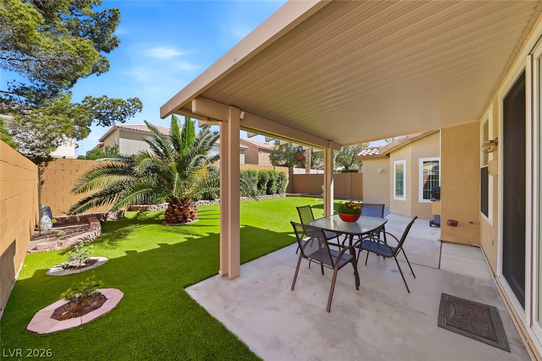 10 Rising Sun Court Henderson, NV 89074 - Photo 30 of 38 Beautiful backyard with covered patio, shrubs.