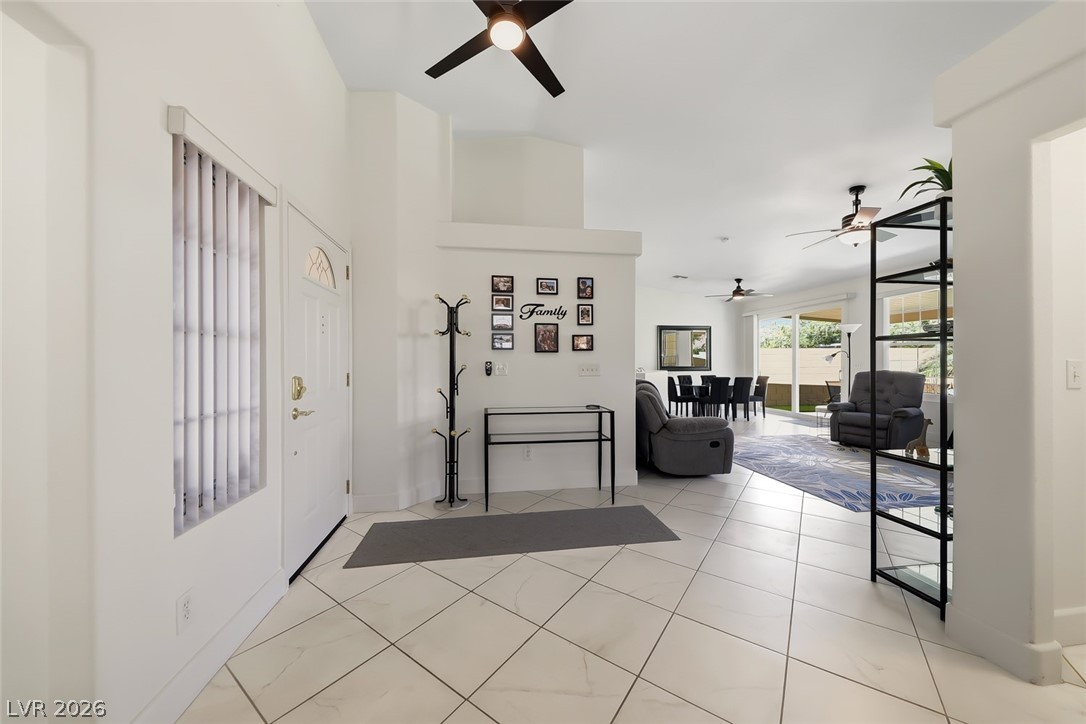 10 Rising Sun Court Henderson, NV 89074 - Photo 3 of 38 Foyer with tile flooring and ceiling fan.
