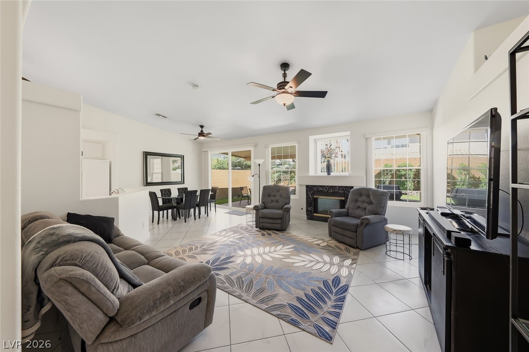10 Rising Sun Court Henderson, NV 89074 - Photo 4 of 38 Spacious living room with ceiling fan, lots of natural light.
