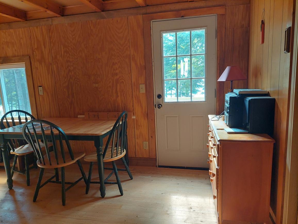 64 Chestnut Lane Rangeley, ME 04970 - Photo 12 of 36 front door to deck and pond