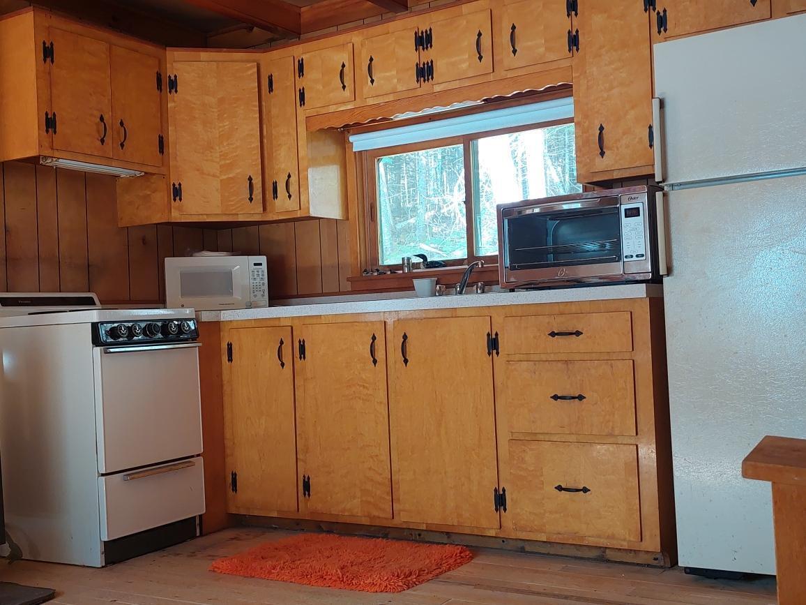 64 Chestnut Lane Rangeley, ME 04970 - Photo 14 of 36 kitchen is open to living area