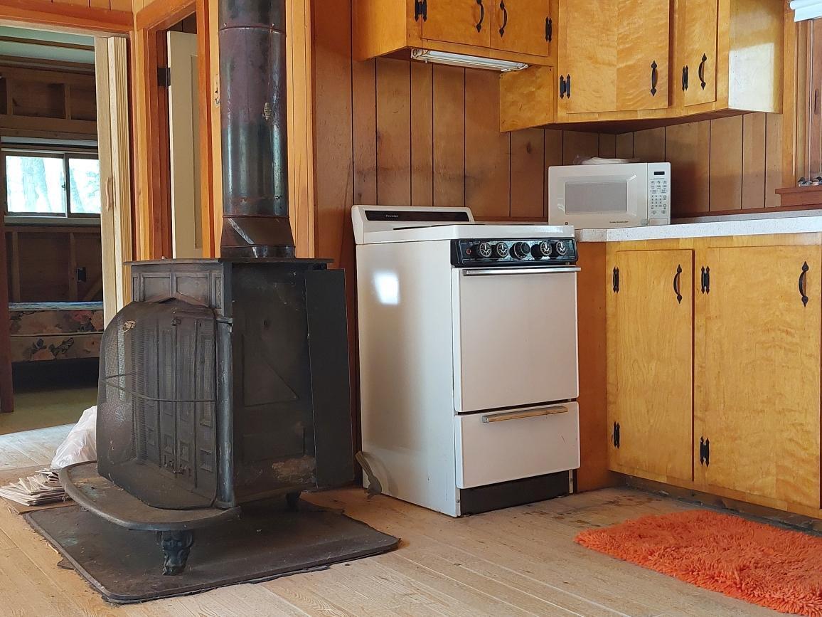 64 Chestnut Lane Rangeley, ME 04970 - Photo 16 of 36 wood stove easily heats the camp