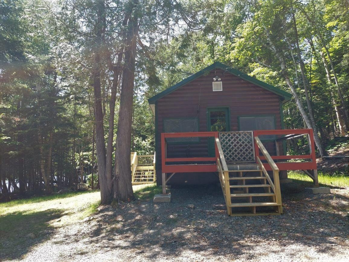 64 Chestnut Lane Rangeley, ME 04970 - Photo 4 of 36 Side of camp with drck and pprch entry