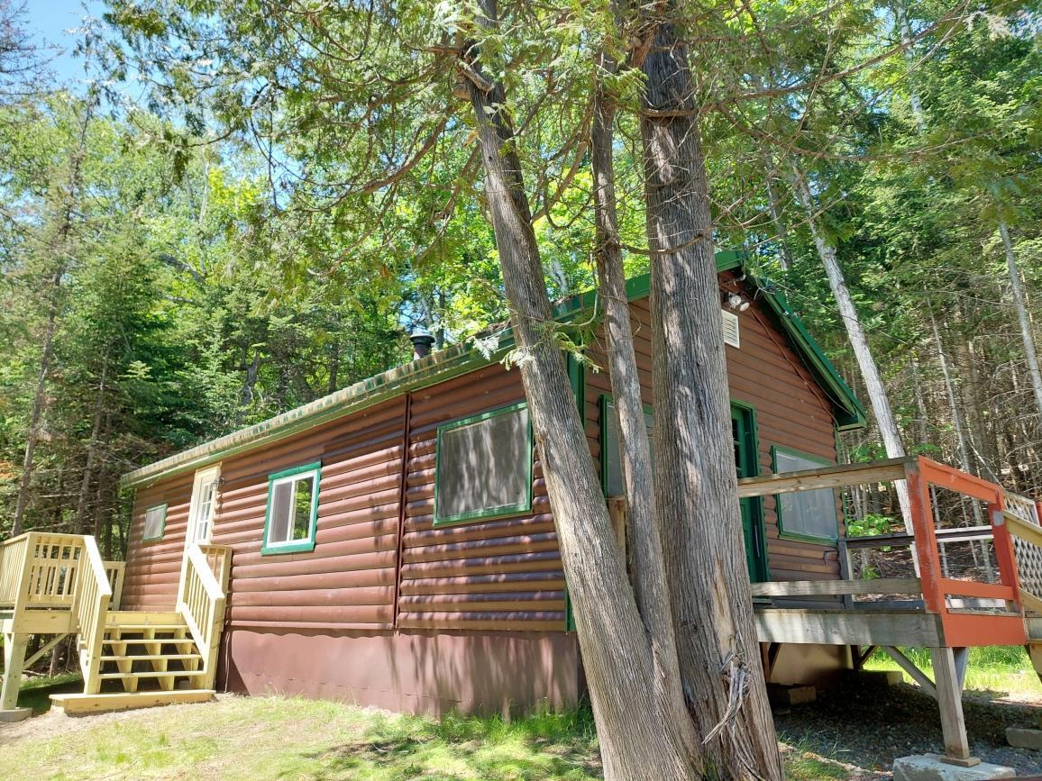 64 Chestnut Lane Rangeley, ME 04970 - Photo 5 of 36 note front deck side deck and porch room