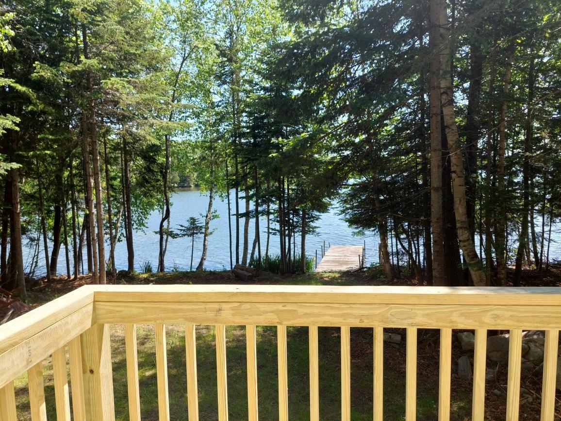 64 Chestnut Lane Rangeley, ME 04970 - Photo 9 of 36 view from deck to pond
