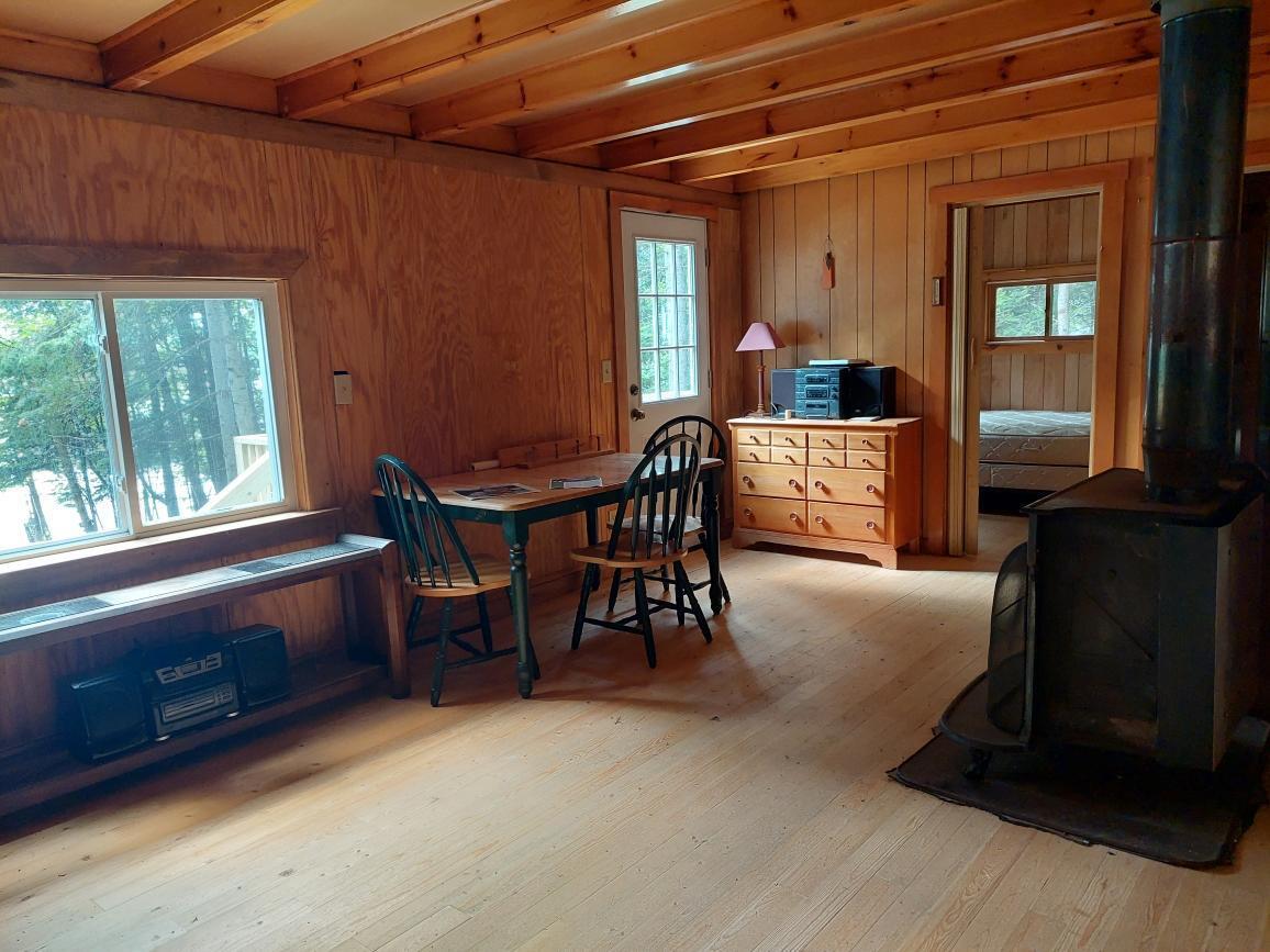 64 Chestnut Lane Rangeley, ME 04970 - Photo 10 of 36 living room dining area