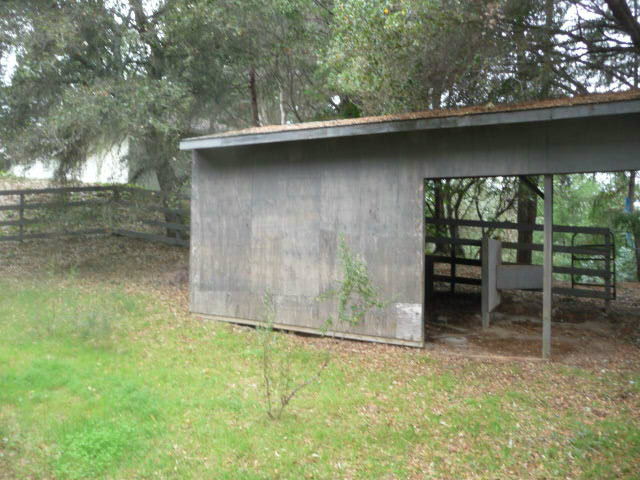 310 Rider Ridge Road Santa Cruz, CA 95065 - Photo 11 of 12 a backyard of a house with table and chairs