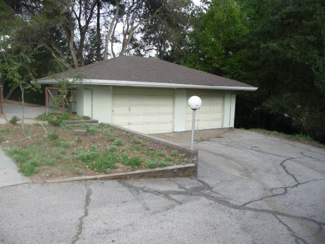 310 Rider Ridge Road Santa Cruz, CA 95065 - Photo 10 of 12 a front view of a house with garden