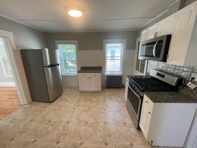 86 Margin Street, Unit 2 Haverhill, MA 01832 - Photo 17 of 28 a kitchen with stainless steel appliances granite countertop a refrigerator stove and sink