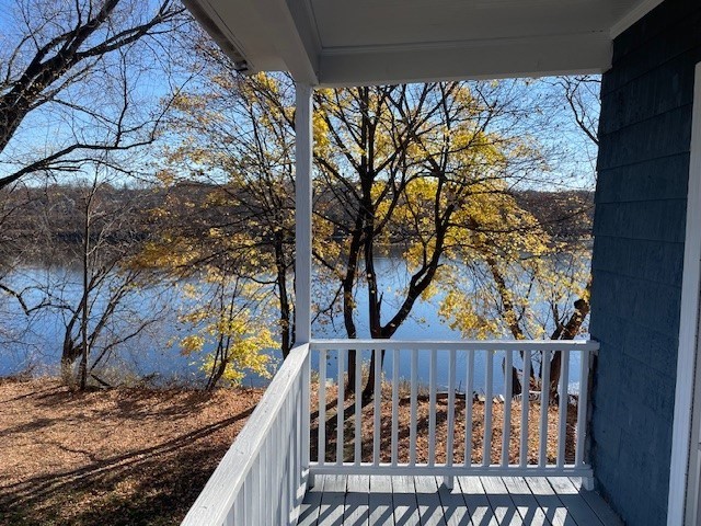 86 Margin Street, Unit 2 Haverhill, MA 01832 - Photo 6 of 28 a view of balcony with wooden floor and fence