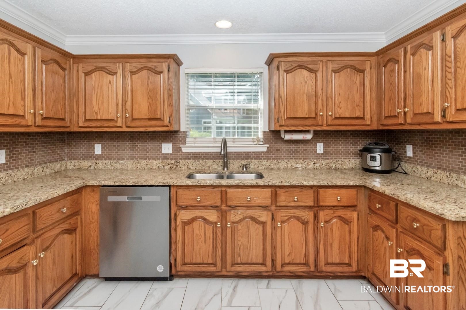 9991 Wedgefield Court Mobile, AL 36608 - Photo 8 of 30 Kitchen featuring sink, stainless steel dishwasher, light stone countertops, and backsplash